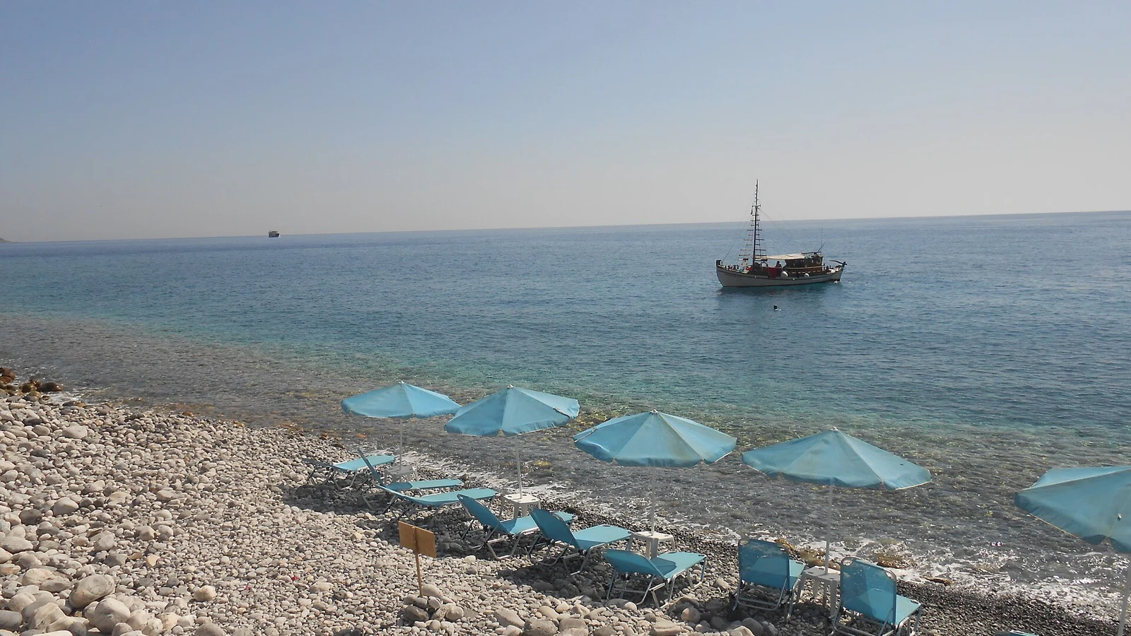 Beach umbrellas and the sea at Agia Roumeli