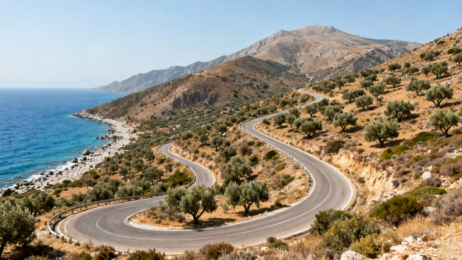 A winding road climbing from the Mediterranean coast